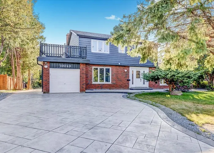 Stunning 7 Bedroom Rougeview Home With 2 Kitchens, 5 Bathrooms, Amazing Backyard & 8-Car Parking